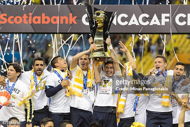 Club America team members hold aloft the CONCACAF Champions trophy after defeating the Montreal Impact 4-2 in the 2nd Leg of the CONCACAF Champions...