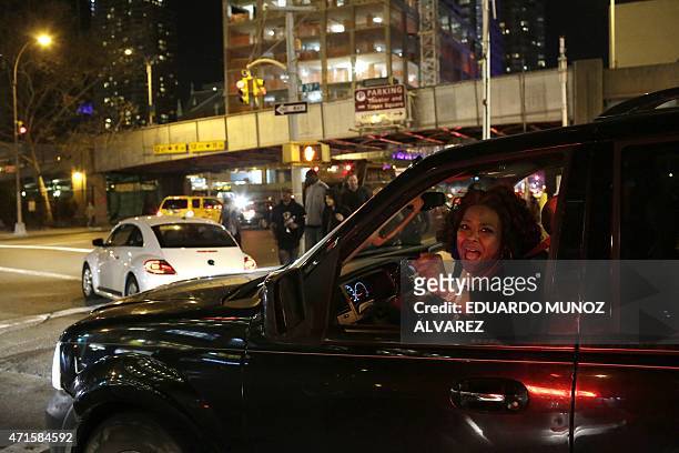Woman shouts slogans "Black live Matter" as demonstrators march during a protest April 29, 2015 in New York, held in solidarity with demonstrators in...