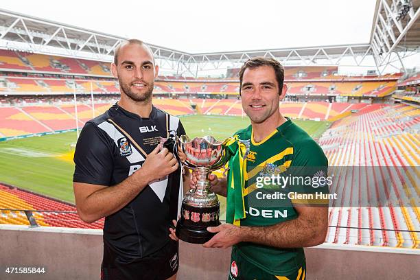 New Zealand captain Simon Mannering and Australian captain Cameron Smith pose with trophy ahead of the International Test match during a press...