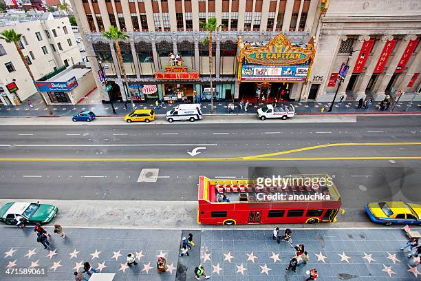 hollywood boulevard, tour bus and el capitan theatre - walk of fame stock pictures, royalty-free photos & images
