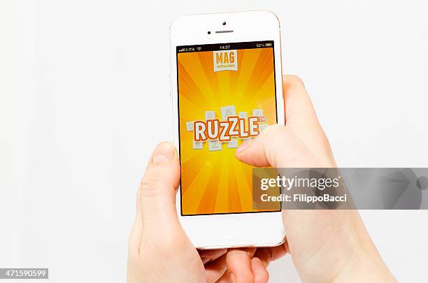 ruzzle app on an iphone 5 - word game stock pictures, royalty-free photos & images