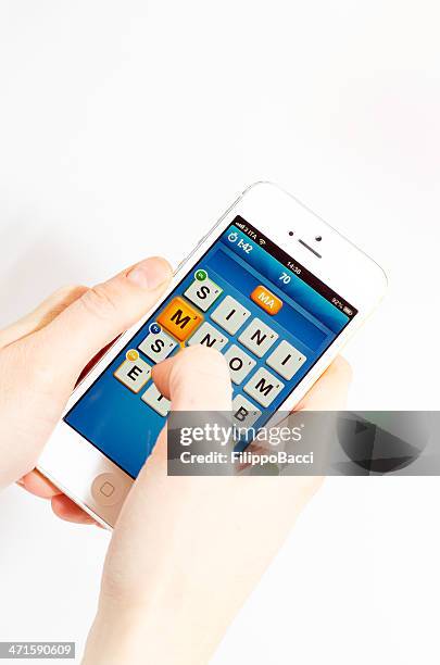 ruzzle app on an iphone 5 - word game stock pictures, royalty-free photos & images