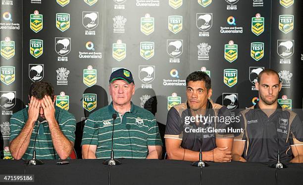 Australia captain Cameron Smith and coach Tim Sheens sit alongside New Zealand coach Stephen Kearney and captain Simon Mannering at a press...