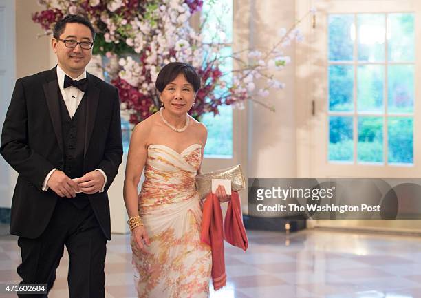 Glen Shigeru Fukushima and Mazie Hirono, U.S. Senator , arrive at the White House for a state dinner with the Japan's Prime Minister Shinzo Abe and...