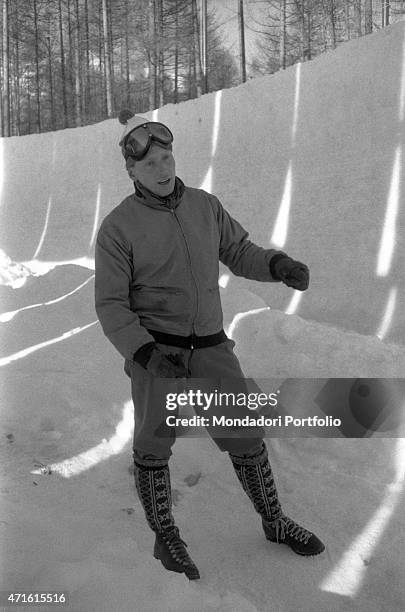 Member of a bobsleigh team competing in the VII Olympic Winter Games checking the track. Cortina d'Ampezzo, 1956 "