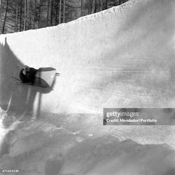 Bobsleigh driver competing in a race at the VII Olympic Winter Games. Cortina d'Ampezzo, 1956 "