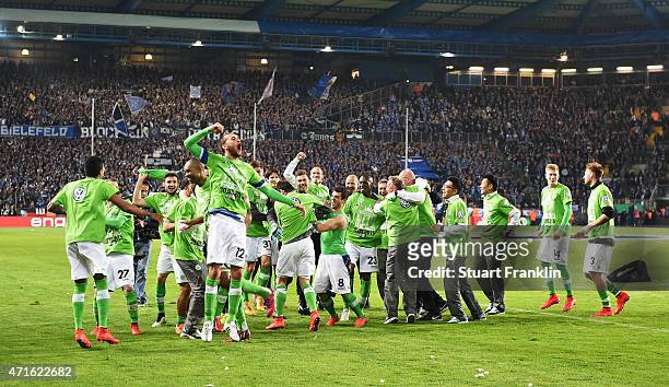 The players and staff of Wolfsburg celebrate after winning the DFB Cup semi final match between Arminia Bielefeld and VfL Wolfsburg at Schueco Arena...