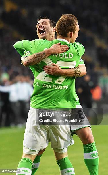 Maximilian Arnold of Wolfsburg celebrates his first goal with Vieira during the DFB Cup semi final match between Arminia Bielefeld and VfL Wolfsburg...