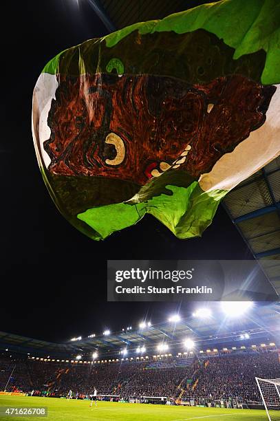Fans of Wolfsburg wave a huge wolf flag during the DFB Cup semi final match between Arminia Bielefeld and VfL Wolfsburg at Schueco Arena on April 29,...