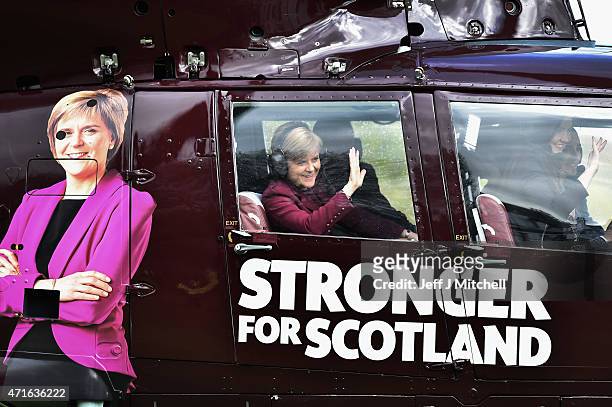 First Minister Nicola Sturgeon and leader of the SNP boards a helicopter at Prestonfield House to continue campaigning on April 30, 2015 in...