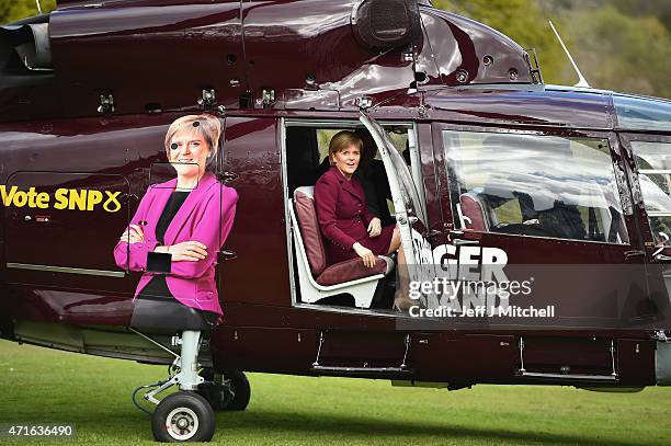 First Minister Nicola Sturgeon and leader of the SNP boards a helicopter at Prestonfield House to continue campaigning on April 30, 2015 in...