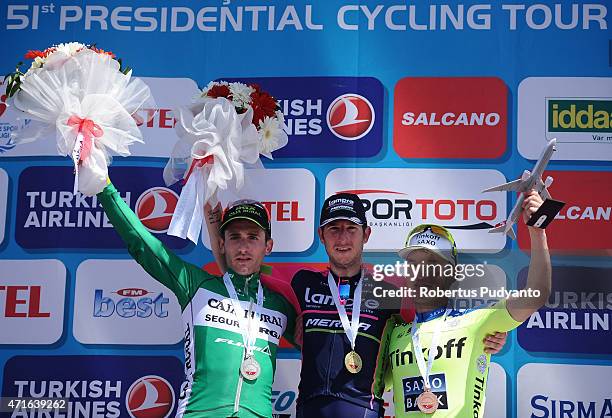 Stage 5 winners Carlos Barbero Cuesta of Caja Rural-Seguros RGA, Sacha Modolo of Lampre - Merida, and Jay McCarthy of Tinkoff - Saxo celebrate on the...