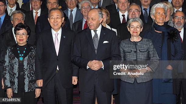 French Foreign Affairs Minister Laurent Fabius poses for a family picture with United Nations Secretary-General Ban Ki-moon , Director general of the...