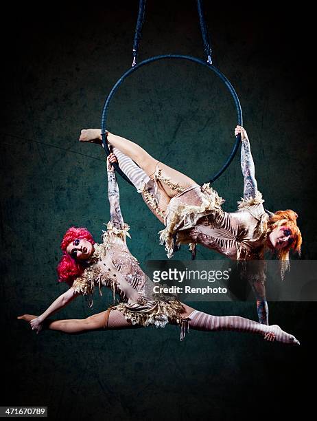 circus performer hoop - akrobatik stock-fotos und bilder