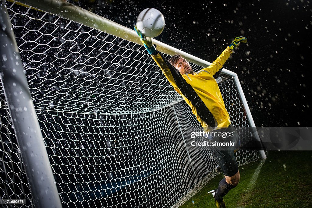 Soccer Goalie Jumping For Ball