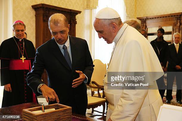 Pope Francis exchanges gifts with President James Alix Michel of the Republic of the Seychelles at the Apostolic Palace on April 30, 2015 in Vatican...