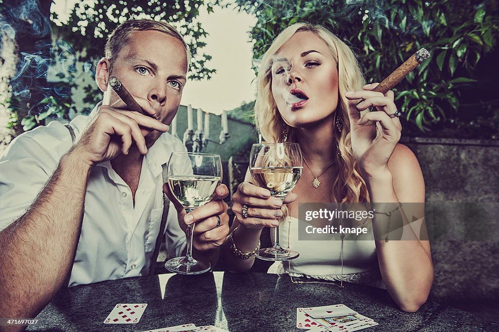 Couple Having A Drink And Smoking Cigar High Res Stock Photo Getty Images couple-having-a-drink-and-smoking-cigar-high-res-stock-photo-getty-images