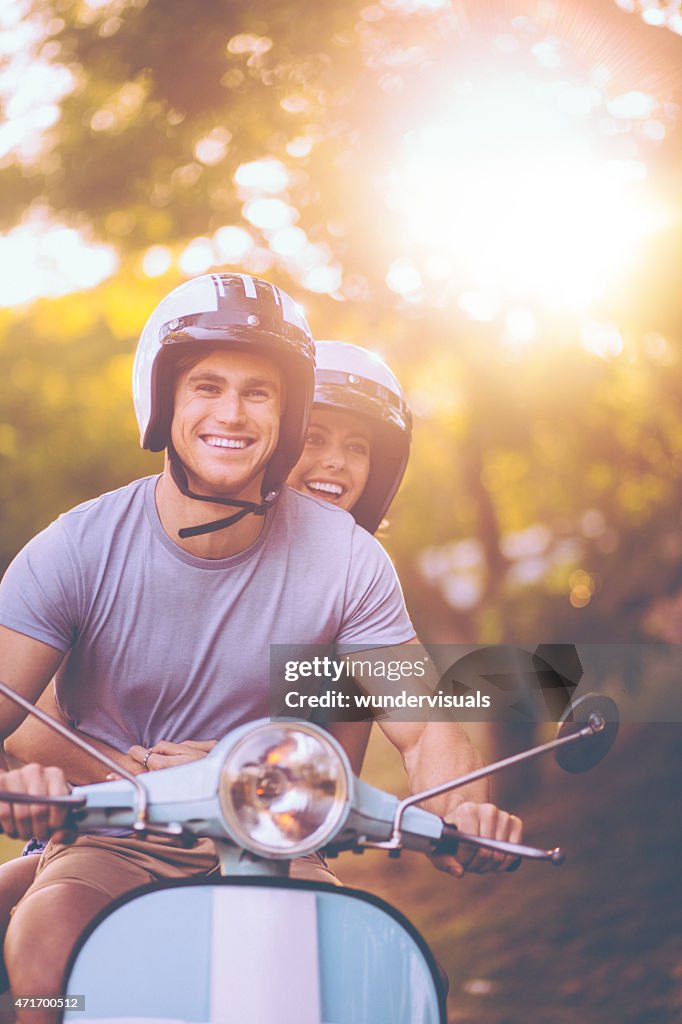 Young couple having a road trip together on their scooter