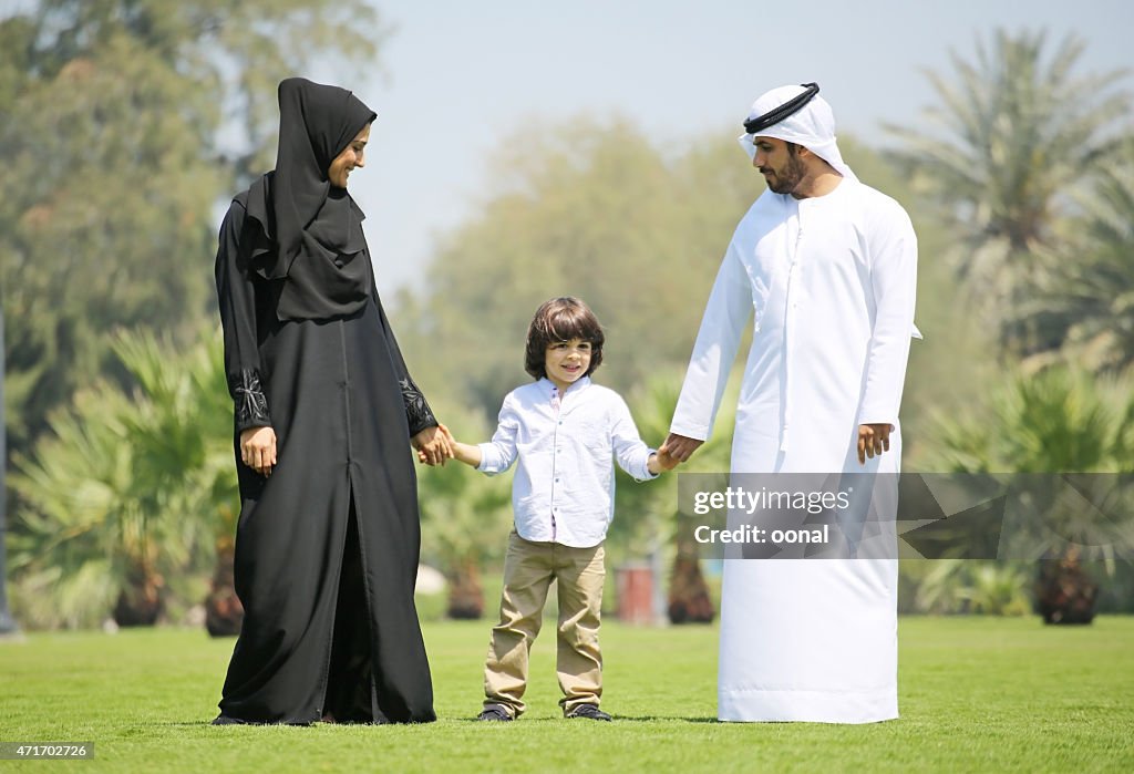 Arab family enjoying their leisure time in park