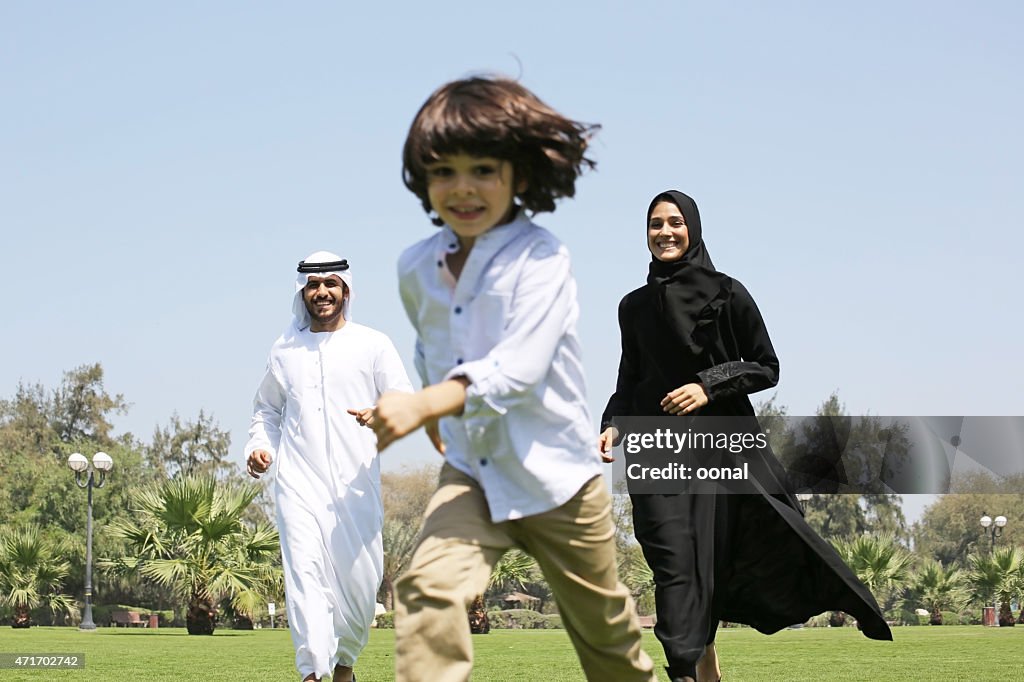 Family enjoying their leisure time in park