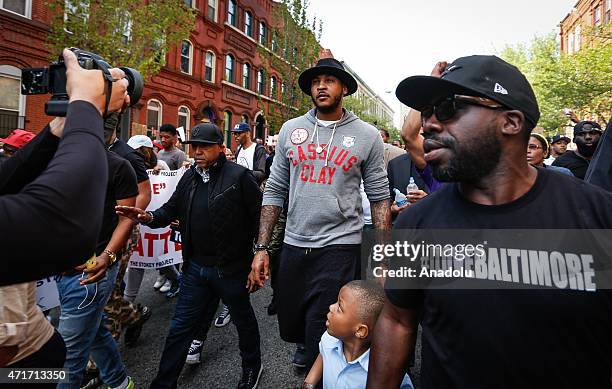 Carmelo Anthony , player of New York Knicks basketball team, is seen as he marches to the city hall, which is being protected by soldiers from the US...