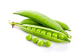 Fresh green pea pods and seeds isolated on white