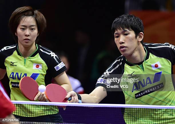 Maharu Yoshimura and Kasumi Ishikawa of Japan compete against Kim Hyok Bong and Kim Jong of North Korea during Mixed Doubles Semi-final Match on day...