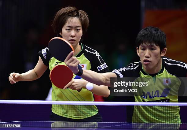 Maharu Yoshimura and Kasumi Ishikawa of Japan compete against Kim Hyok Bong and Kim Jong of North Korea during Mixed Doubles Semi-final Match on day...