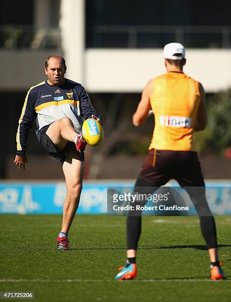 Part time coach David Neitz kicks the ball during a Hawthorn Hawks AFL media session at Waverley Park on May 1, 2015 in Melbourne, Australia.