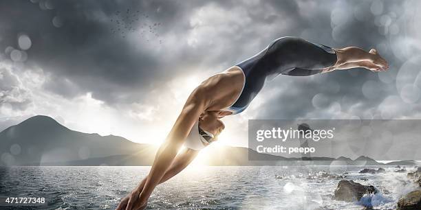 extreme sea swim - extreme sports female stock pictures, royalty-free photos & images