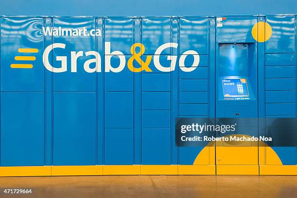 Grab and Go lockers in a Wallmart Superstore. Customers can buy online and come pick the purchase at an assigned locker. Business adapting to cyber...