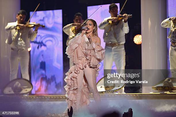 Jennifer Lopez performs musical tribute to Selena while performing with Los Dinos onstage at the 2015 Billboard Latin Music Awards presented bu State...