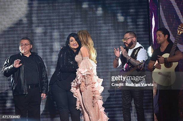 Jennifer Lopez and Los Dinos onstage after performing musical tribute to Selena at the 2015 Billboard Latin Music Awards presented bu State Farm on...