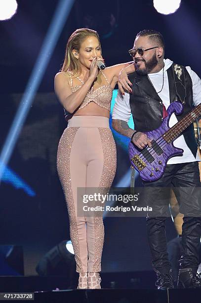 Jennifer Lopez performs musical tribute to Selena while performing with Los Dinos onstage at the 2015 Billboard Latin Music Awards presented bu State...