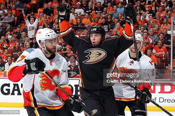 Matt Beleskey of the Anaheim Ducks reacts after scoring against T.J. Brodie, and Matt Stajan of the Calgary Flames in Game One of the Western...