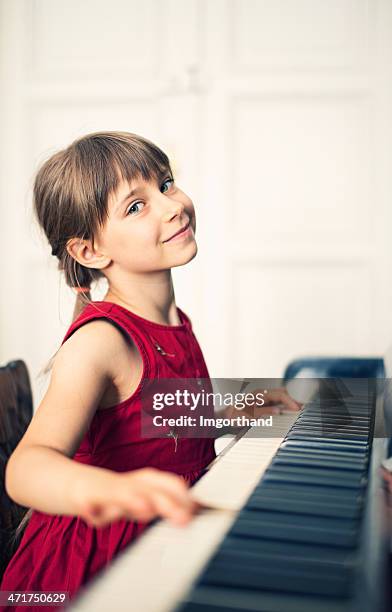 little girl and her piano - pianist front stock pictures, royalty-free photos & images