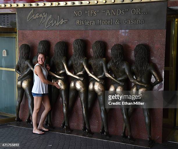 Hayley Saintz of Michigan poses with the "Crazy Girls" bronze sculpture at the Riviera Hotel & Casino on April 30, 2015 in Las Vegas, Nevada. The Las...