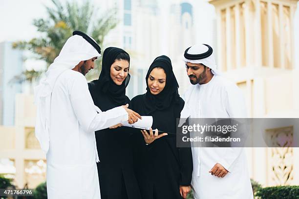 emirati outdoors business conversation - ghoutra stock pictures, royalty-free photos & images