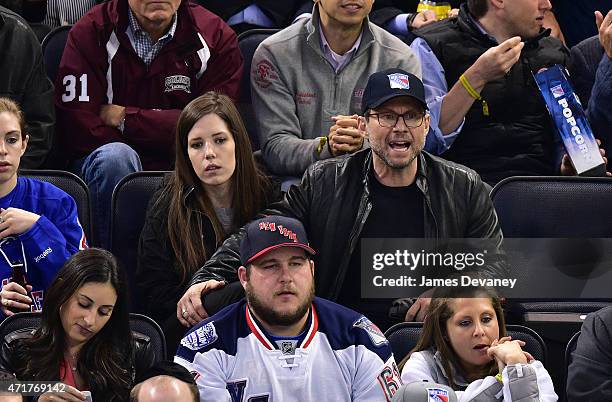 Brittany Lopez and Christian Slater attend the Washington Capitals vs New York Rangers playoff game at Madison Square Garden on April 30, 2015 in New...