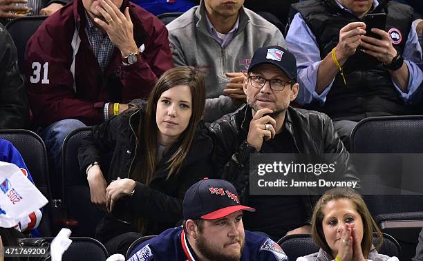 Brittany Lopez and Christian Slater attend the Washington Capitals vs New York Rangers playoff game at Madison Square Garden on April 30, 2015 in New...