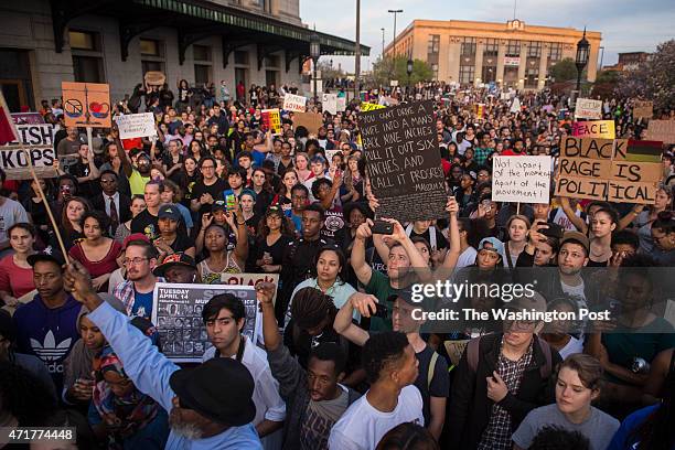 People shout and protest in front of Baltimore Penn Station as protests walk for the death of Freddie Gray around the city in Baltimore, MD on...