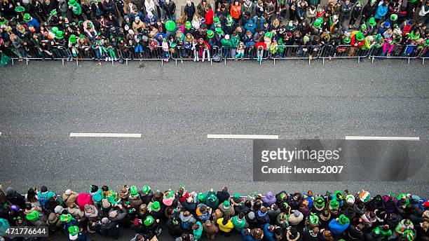 st. patrick's day parade - crowd of people from above stock pictures, royalty-free photos & images