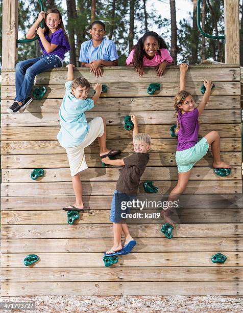 children on climbing wall - summer camp kids stock pictures, royalty-free photos & images