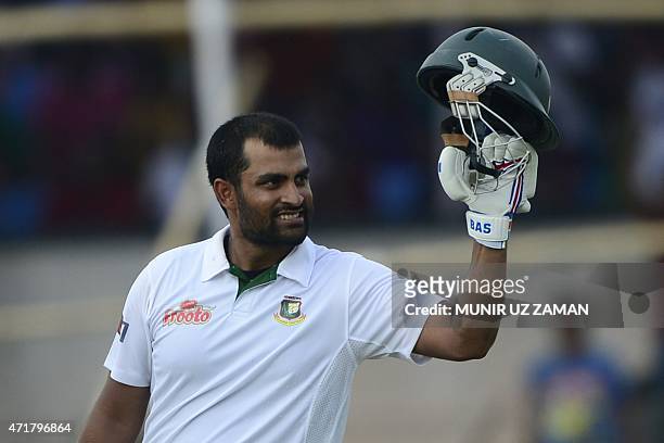 Bangladesh cricketer Tamim Iqbal reacts after scoring a century during the fourth day of the first cricket Test match between Bangladesh and Pakistan...