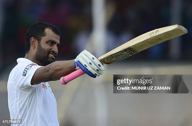 Bangladesh cricketer Tamim Iqbal reacts after scoring a century during the fourth day of the first cricket Test match between Bangladesh and Pakistan...