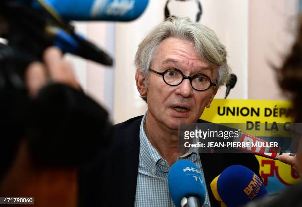 Jean-Claude Mailly, secretary-general of the Force Ouvriere labour union, speaks to the press before addressing supporters at a May Day meeting in...