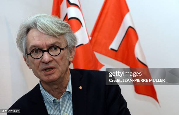 Jean-Claude Mailly, secretary-general of the Force Ouvriere labour union, speaks to the press before addressing supporters at a May Day meeting in...