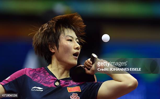 Ding Ning of China serves during her women's singles quarter-final match agains Wu Yang of China at the 2015 World Table Tennis Championships at the...