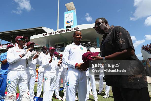 Test debut Shai Hope of West Indies is presented with his cap by Clive Lloyd of West Indies during day one of the 3rd Test match between West Indies...
