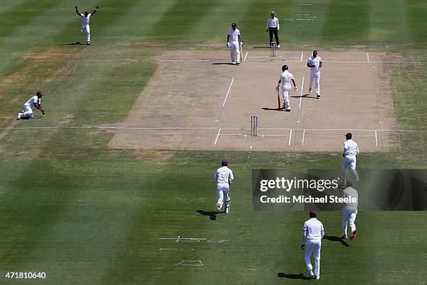 Jonathan Trott of England heads back to the pavillion for a duck after being caught by Veerasammy Permaul off the bowling of Shannon Gabriel of West...